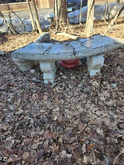 Outdoor Concrete bench  has small crack on it but otherwise it's in good shape to use it on garden  decorations