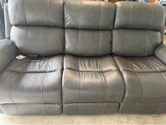Leather sofa with dual recliner