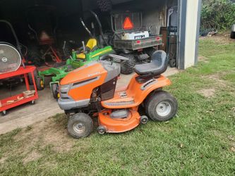 Hasquvana riding mower,needs Carburetor  cleaned,not running  sold as is
