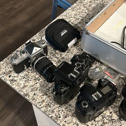 3 Nikon Cameras And Lenses 