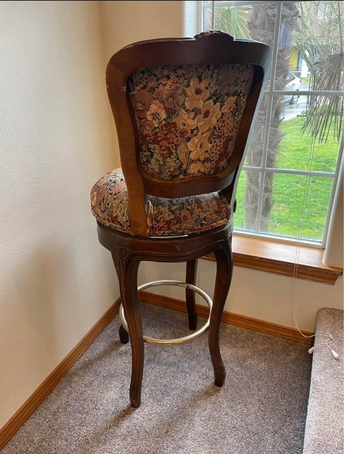 Tall backed cushioned swivel chair