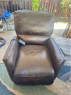 Free plush leather chair  recliner with detail stones. Chair works great. Needs a nice leather cleaning and polish to look like new.   Pickup Only