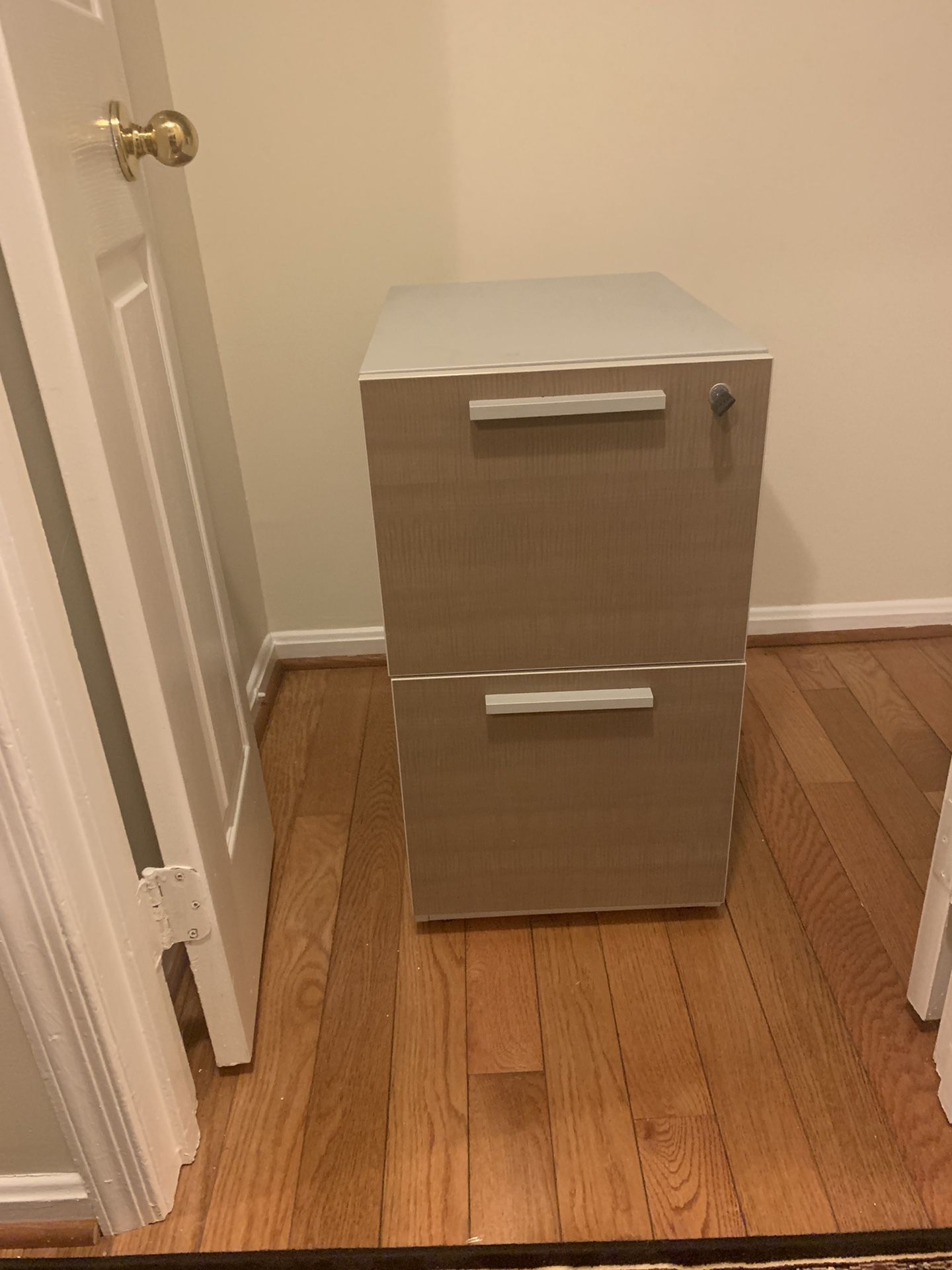 Metal filing cabinet with two drawers in good condition.