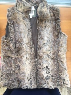 New. Faux fur vest size large