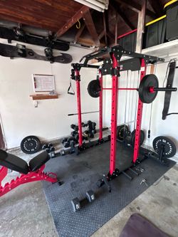 Major fitness squat rack, barbell, and bench.