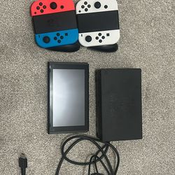 Nintendo switch with 2 controllers