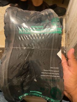 Black Sneakers Still in Plastic Wrap