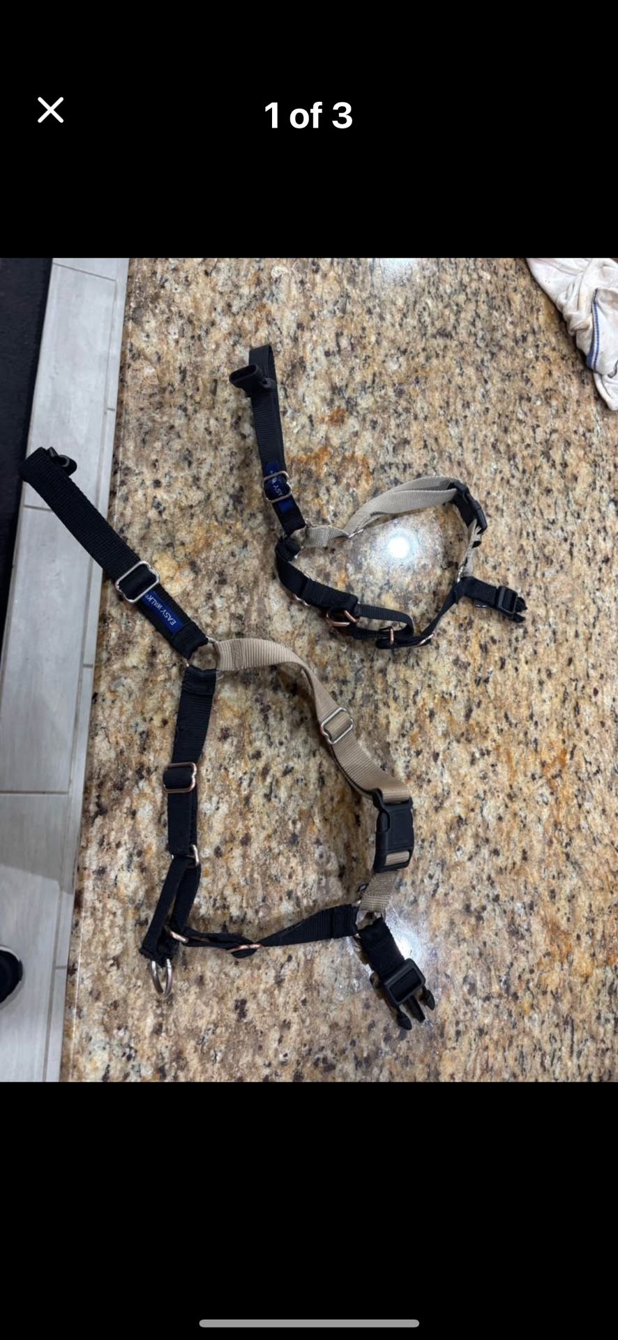 Two dog harnesses one large and one small