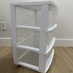 White rolling cabinet storage bin