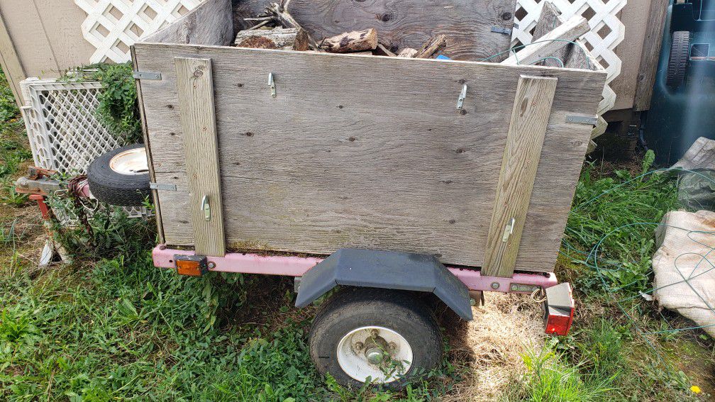 Utility trailer with fire wood