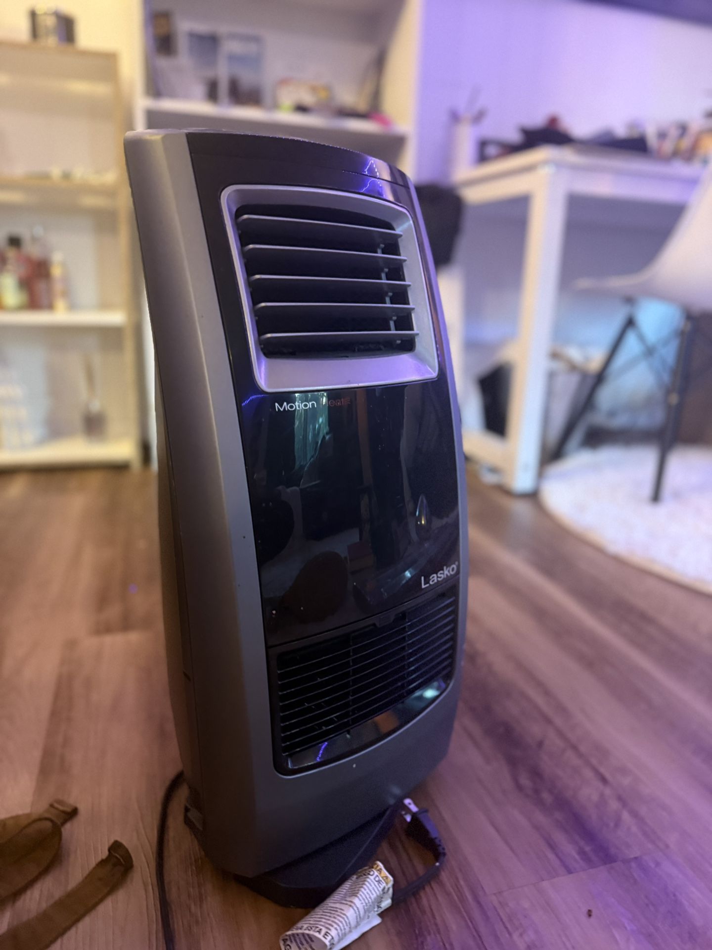 Lasko tower portable heater fan in black and gray. Features motion heat technology. Ready for the winter time.
