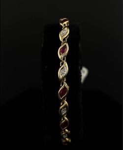 Gorgeous 14k Yellow Gold bracelet with small diamonds and red tones