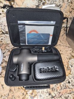 Mebak 3 Deep Tissue Percussion Massage Gun packed inside its portable zippered carrying case.