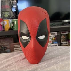 Deadpool and Wolverine head popcorn bucket.