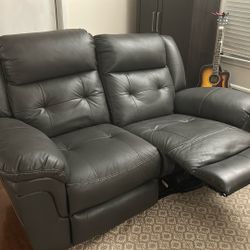 Comfortable Gray Leather Electric Reclining Loveseat $250