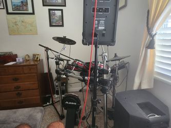 Alexis crimson 2 drum kit with drum amp, blue tooth amp. Loaded