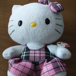 Hello Kitty 6" plush with pink & black plaid dress & bow
1/2 of tag is missing. Item is still good condition. 