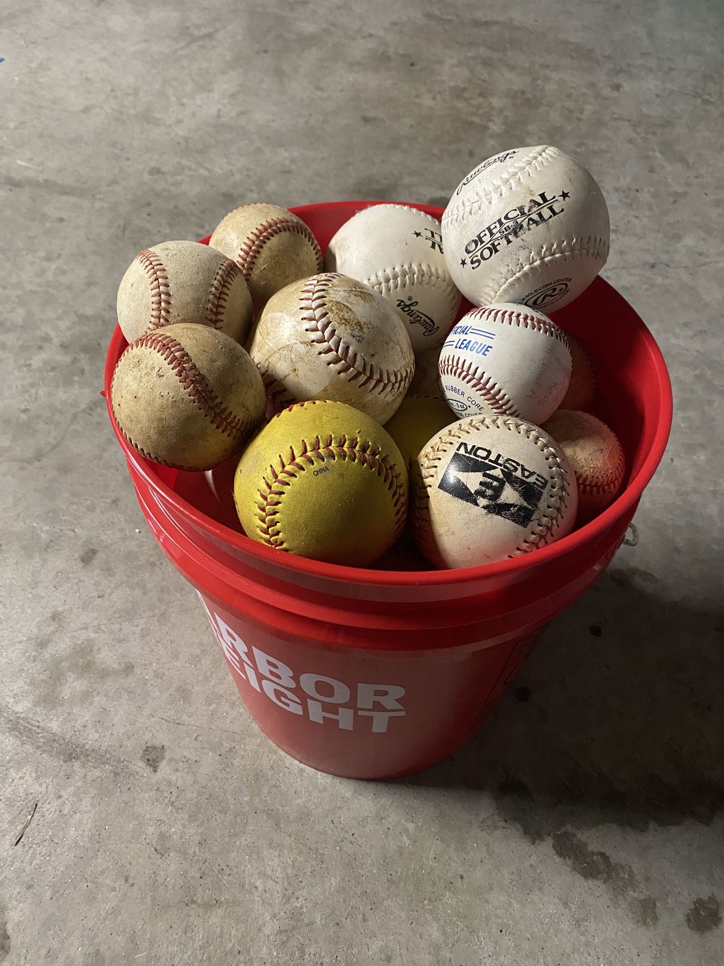 Bucket Of Softball And Baseballs