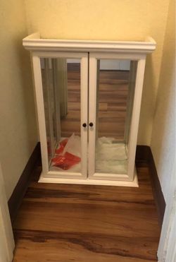 White display case with glass dividers