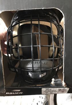 Black and white Bauer hockey helmet