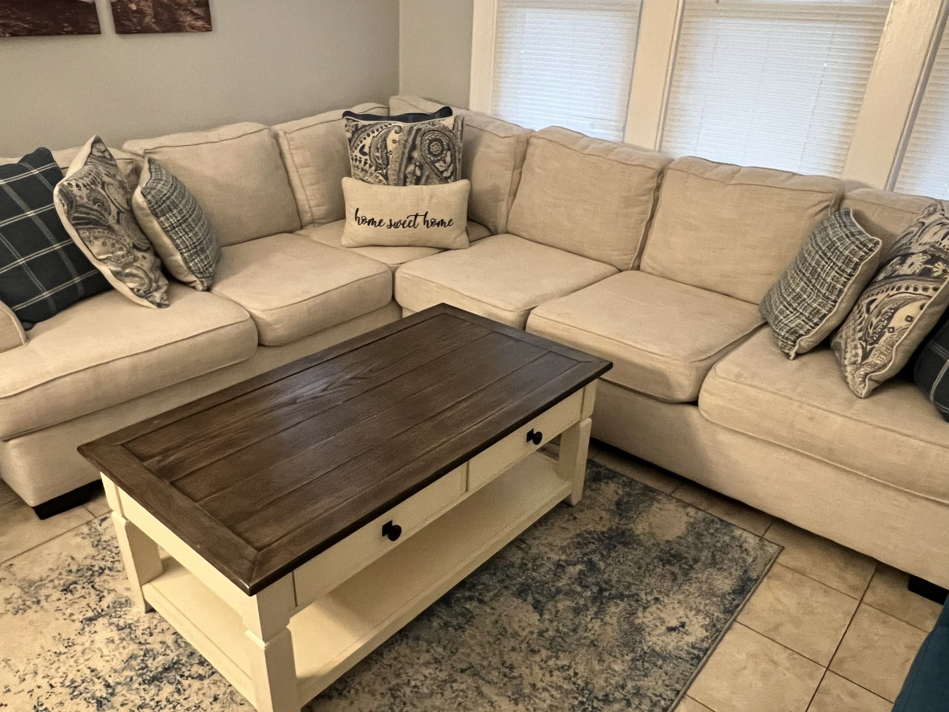 Beige Sectional With Coffee Table And Two End Tables 