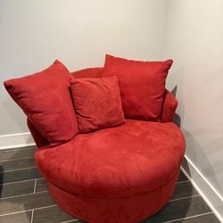 Red swivel sofa chair