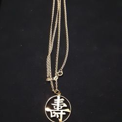 14K GOLD 24" CHAIN AND ASIAN CHARM