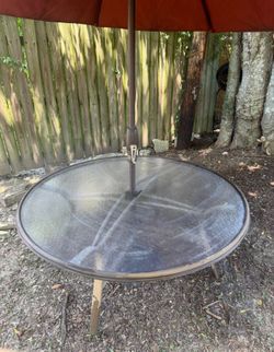 Outdoor patio table and umbrella