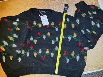 Suvimuga brand women's black Christmas sweater featuring a colorful light bulb pattern