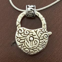 vintage silver tone locket with 925 silver snake shaped charm.