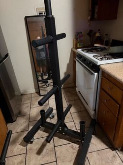 Olympic size tree stand and 2 bar holder on wheels