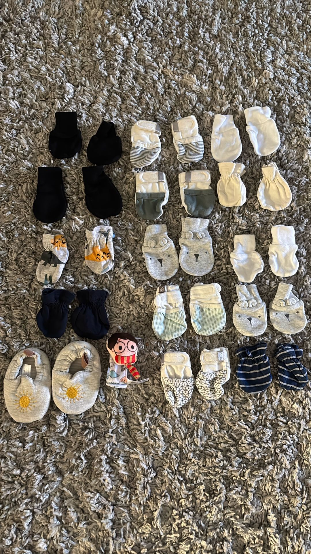 Newborn baby mittens and one pair of newborn baby shoes
