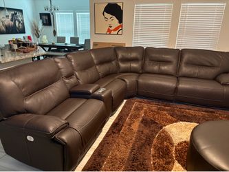 Leather sectional with powered recliner and console