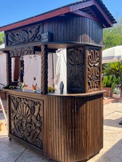 Hand-Carved Wooden Outdoor Bar with Roof