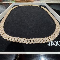 Iced out 14k JAXXON Cuban link with box clasp.  10mm 26” with original box. Never worn. Price is $350 before taxes and shipping, asking $225 or best o