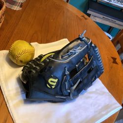 Wilson oversized 13” softball glove like new condition correctly broken in model A2477 adjustable wrist comes with 2 softballs Perfect for adult or te