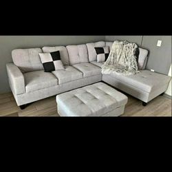 New white grey sectional and ottoman 
