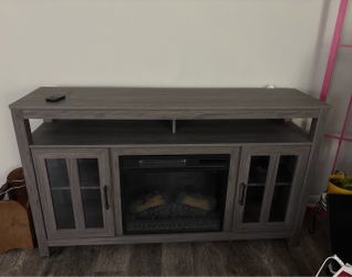 Gray Fireplace with Remote