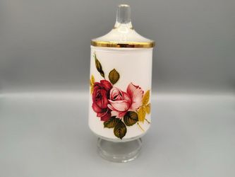 vintage frosted glass apothecary jar features a vibrant red and pink floral design with gold trim accents