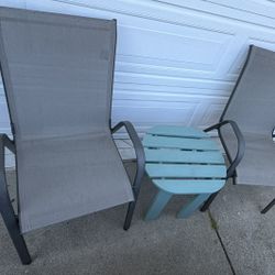  Outdoor Patio Set of 2  grey sling chairs with black metal frames and a turquoise blue slatted side table