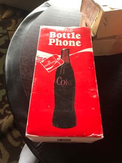 Coke bottle phone in box