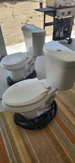 2 Glacier Bay Toilets