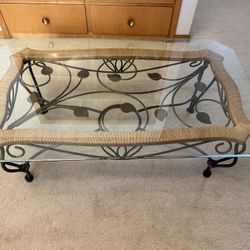 Glass top coffee table with decorative Wrought iron base