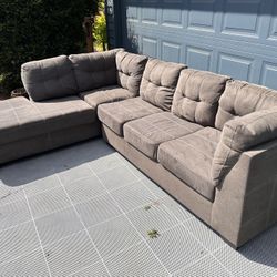 Delivery available - Large gray sectional couch