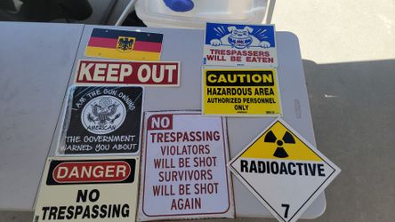 Lot of misc. warning signs, trespassing signs