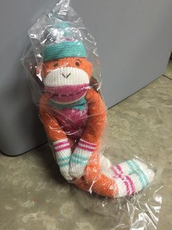 Brand new orange sock monkey stuffed animal