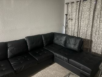 Black leather sectional storage ottoman  included