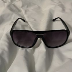 Black Framed Sunglasses With Purple Tint And Silver Colored Accent