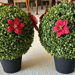 Set of 2 Boxwood faux topiary balls in black plastic planter. Removable clip in poinsettias And Dragonfly