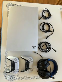PlayStation 5 with two controllers